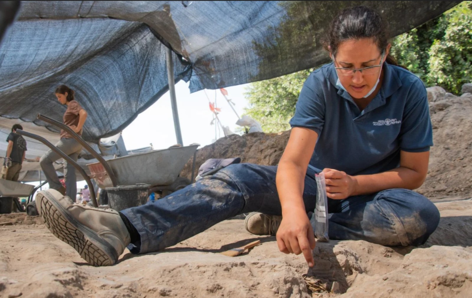 Excavation director Liat Nadav-Ziv with the cache.Photo by Yoli Schwartz/Israel Antiquities Authority