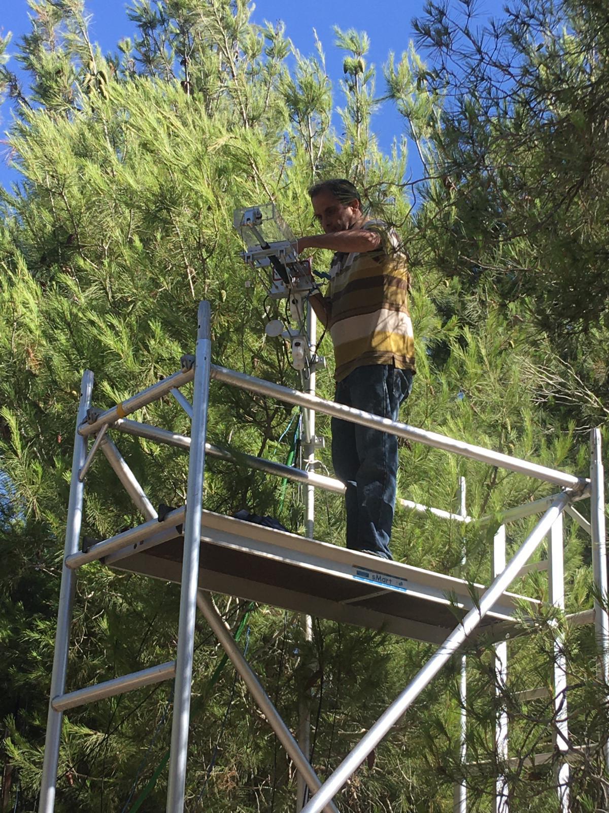 Dr. Rafat Qubaja taking measurements of carbonyl sulfide in Yatir Forest. Photo by Itay Oz