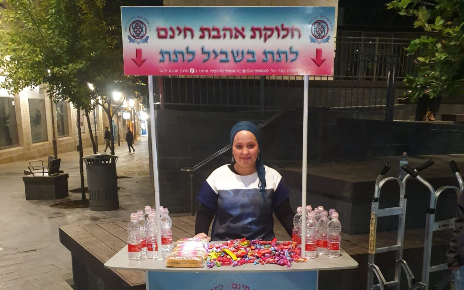 Safranai stands behind the stall that she and her Free Love volunteers set up in JerusalemSafranai stands behind the stall that she and her Free Love volunteers set up in Jerusalem. Photo: courtesy. Photo: courtesy