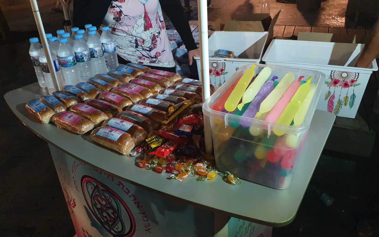 Tova Safranai and her Free Love volunteers give snacks and water to homeless youth. Photo: courtesy