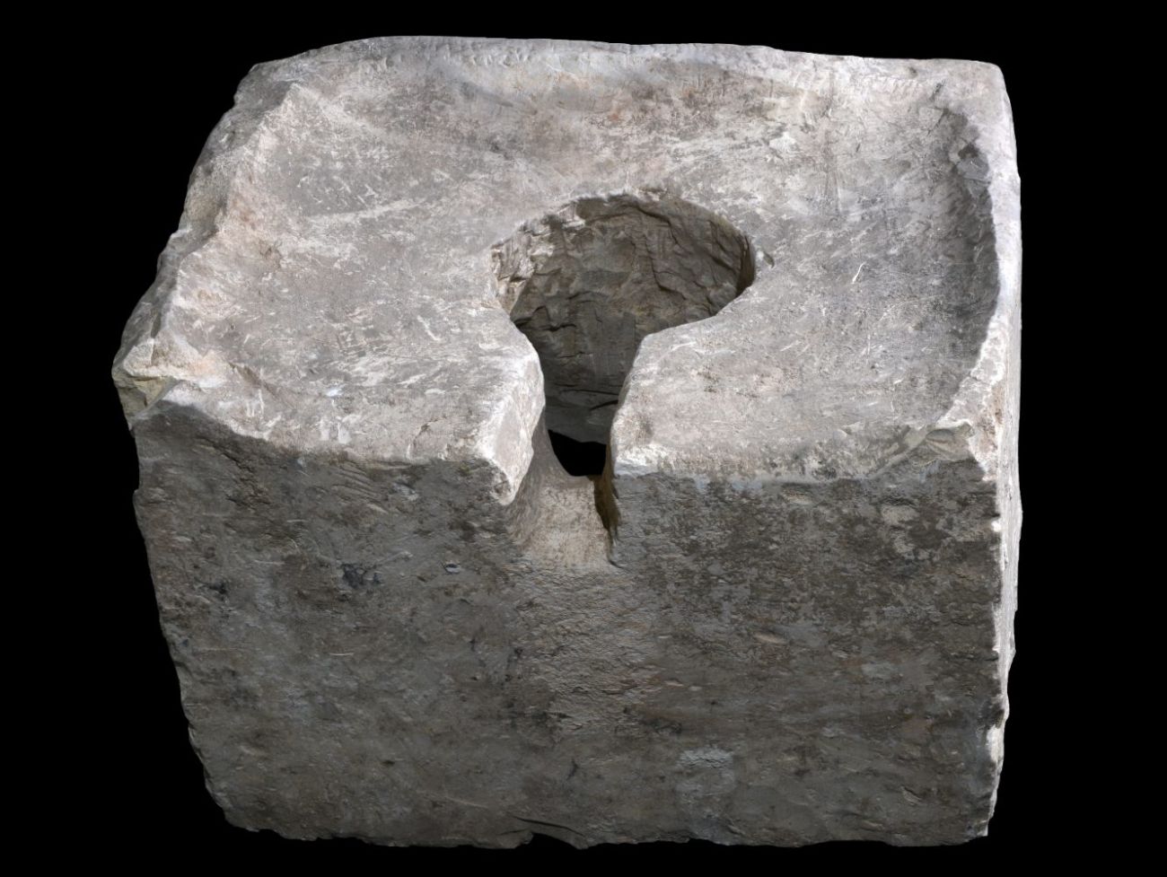 A stone toilet found inside the Holy of Holies of Lachish’s city-gate temple. Photo by Clara Amit/Israel Antiquities Authority