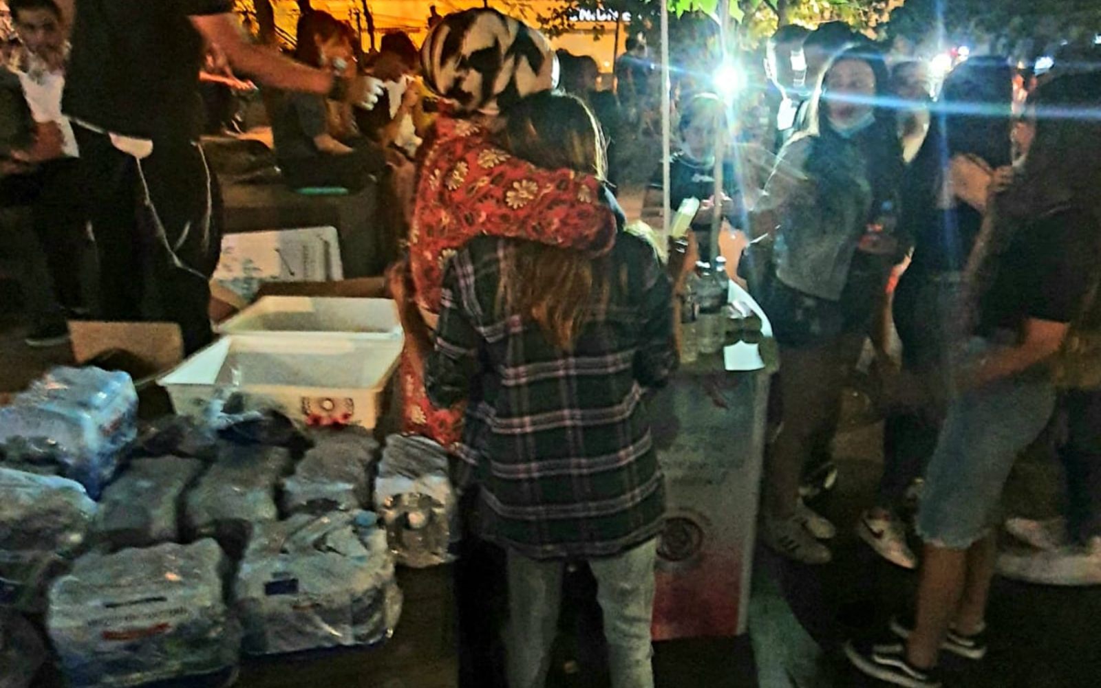 Safranai (left), hugs a girl on the streets of Jerusalem. Photo: courtesy