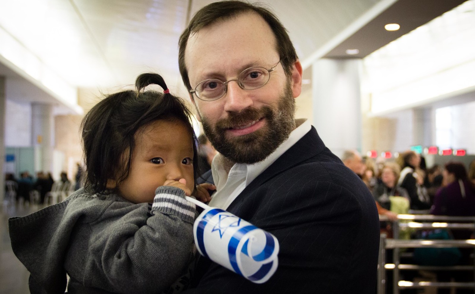 Rabbi Michael Freund of Shavei Israel with a Bnei Menashe arrival. Photo by Laura Ben-David