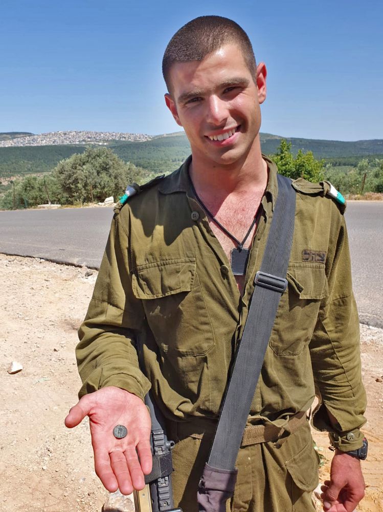 IDF IDF soldier Ido Gardi with the coin he found. Photo by Nir Distelfeld/Israel Antiquities Authority Ido Gardi with the coin he found. Photo by Nir Distelfeld/Israel Antiquities Authority