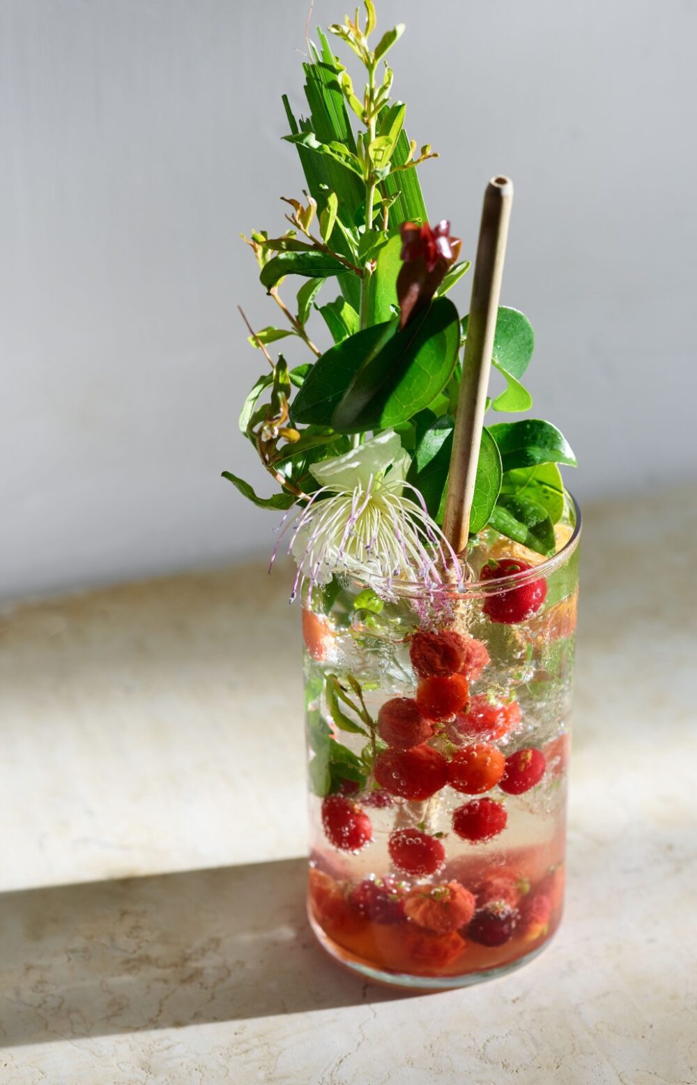 This Surinam cherry gazoz contains fresh and fermented Surinam cherries, lemongrass, caper blossoms, pomegranate leaves and seltzer. Excerpted from “Gazoz” by Benny Briga and Adeena Sussman (Artisan Books). Copyright © 2021. Photograph by Dan Perez