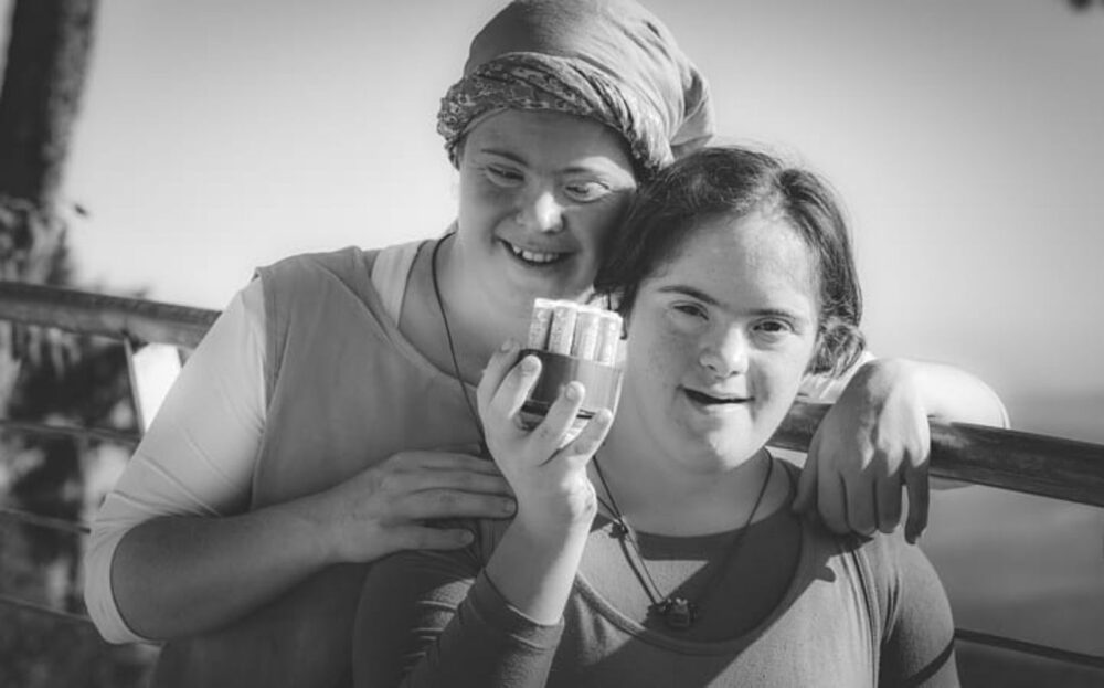 Keren and Shalhevet Ben-Baruch, daughters of Neshikha cofounder Chaya Ben-Baruch, with a package of organic scented lip balm. Photo: davidbrianbender.com