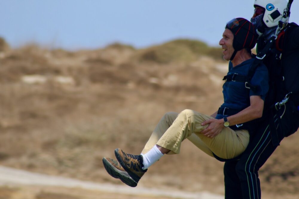 Brian Blum coming in for a landing with tandem instructor Arad Ben David. Photo by Merav Blum