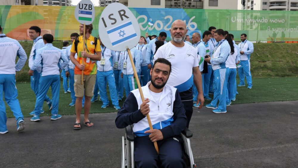 Israeli Arab Paralympic swimmer Iyad Shalabi with his father, Yusuf, at the 2016 Rio Games. Photo courtesy of the IPC