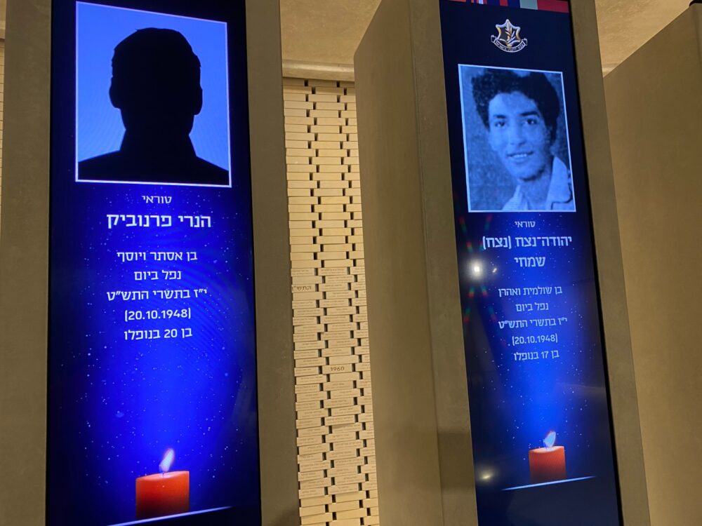 The yahrzeit display in the Mount Herzl Hall of Remembrance for Henri Fernebock, left, has no picture of his face. Photo by Abigail Leichman