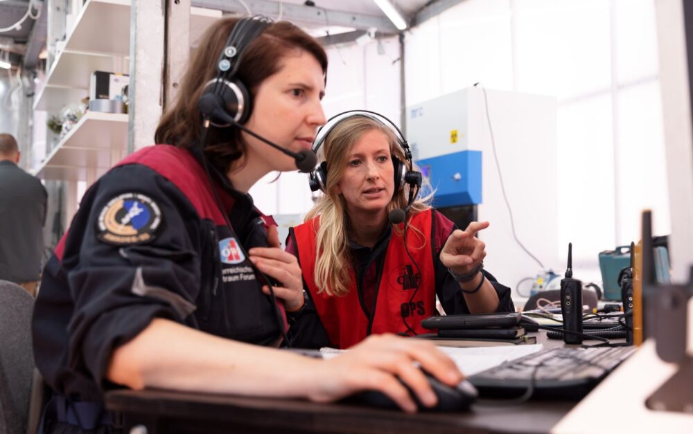 Control teams aid in preparation for the mission.Photo by Florian Voggeneder/OeWF