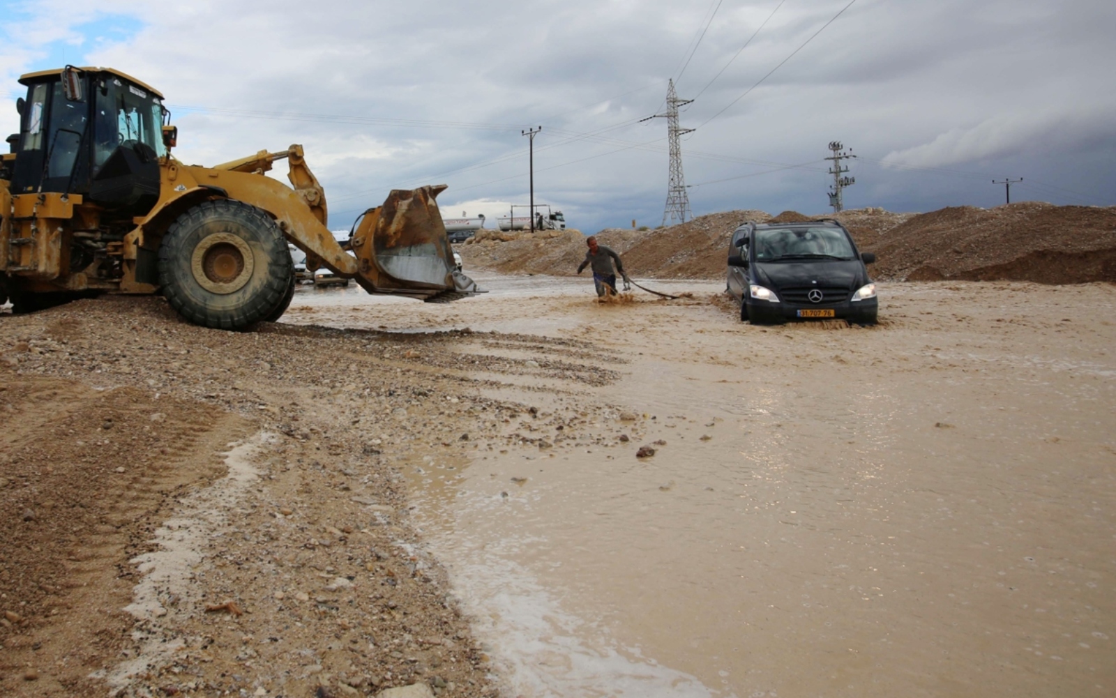 A car stuck in the floods after heavy rain outside Jerusalem. Photo by FLASH90