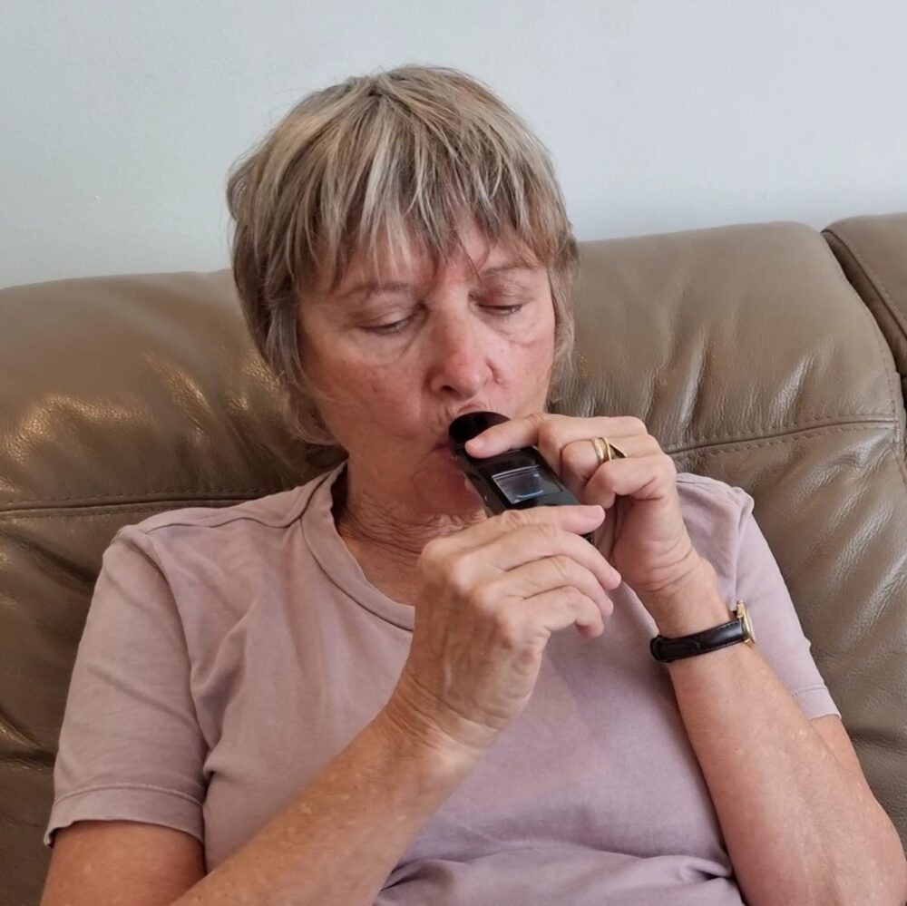 A woman using a prototype of the OmnySense device. Photo courtesy of OmnySense