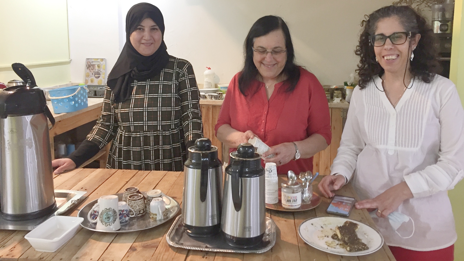 From left, basket-weaving teacher Myasar Khamaisy, volunteer Ronit Erez and Nadia Giol, co-director of Sindyanna of the Galilee. Photo by Diana Bletter