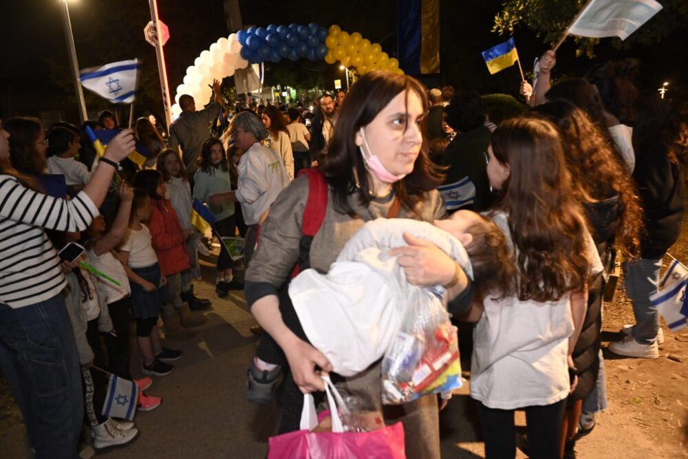Malka Bukiet carrying a baby from Alumim into Nes Harim in April 2022. Photo courtesy of KKL-JNF