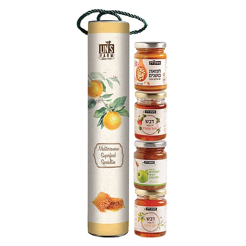 A cylindrical gift box decorated with an orange illustration stands next to four stacked jars of various honey and fruit spreads, each with colorful labels and Hebrew text.