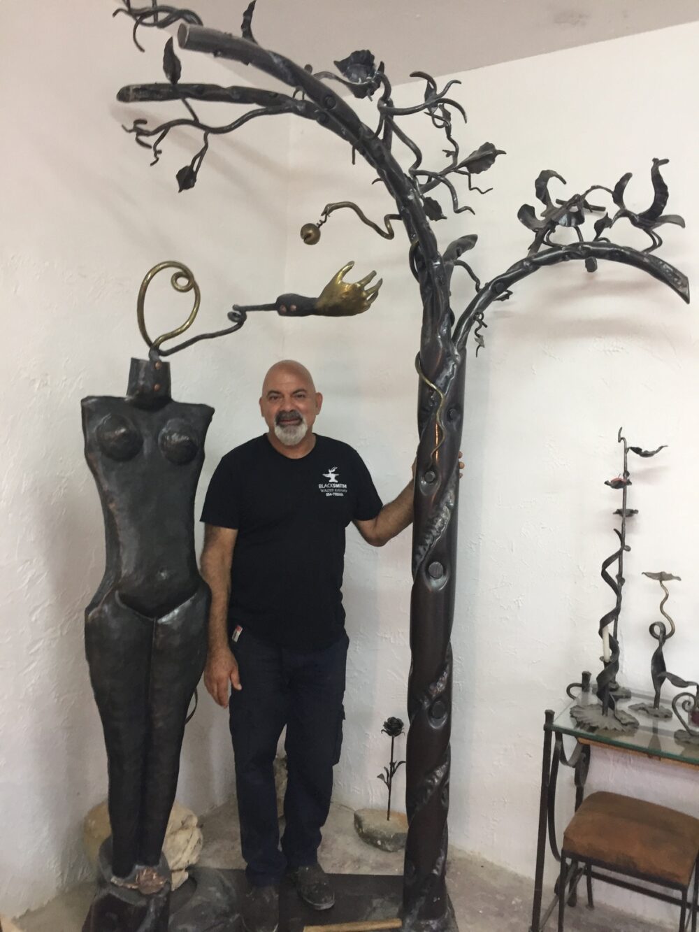 Walied Khoury with his sculpture of Eve and the tree in the Garden of Eden. Photo by Diana Bletter