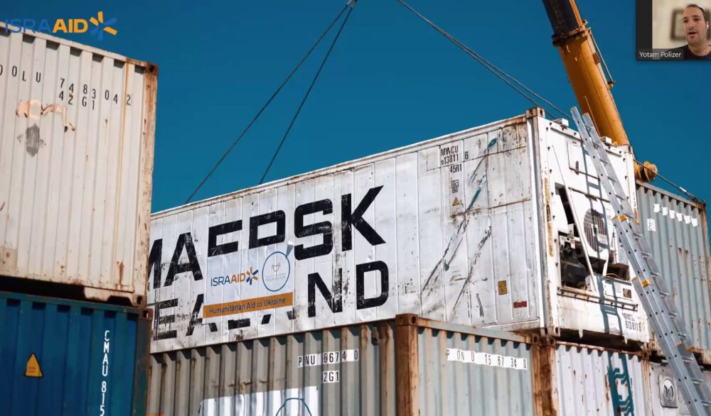 Yotam Polizer explaining how IsraAID ships food and hygiene supplies to displaced Ukrainians. Photo: screenshot