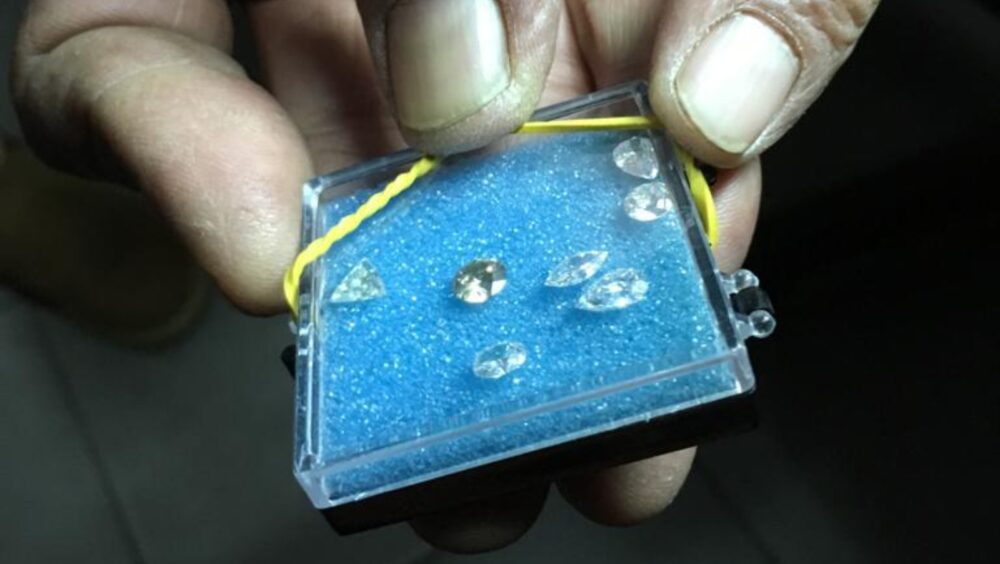 An Israeli diamond cutter showing off his polished diamonds. Photo courtesy of IsraelTours4U