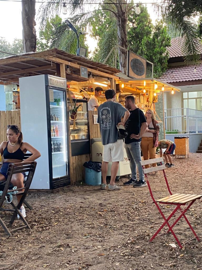 Diners at Ramota food cart on Moshav Ramot Hashavim. Photo by Elana Shap