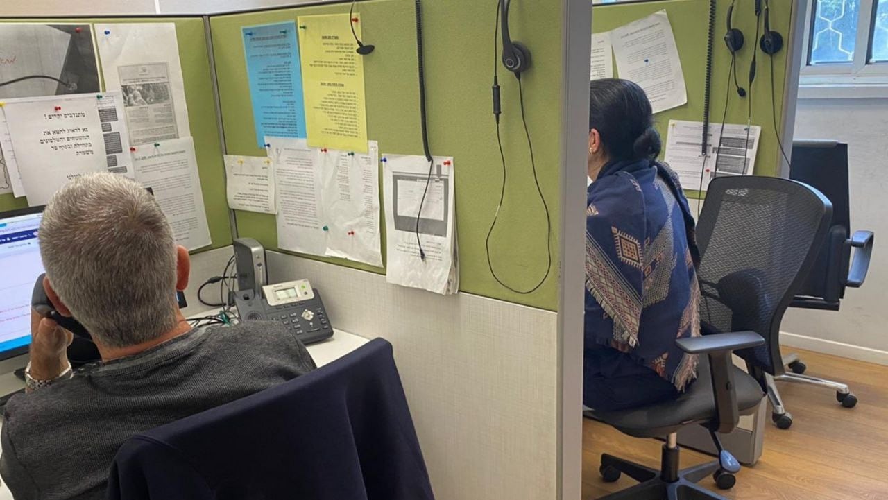 Two ERAN volunteers answering calls. Photo courtesy of ERAN