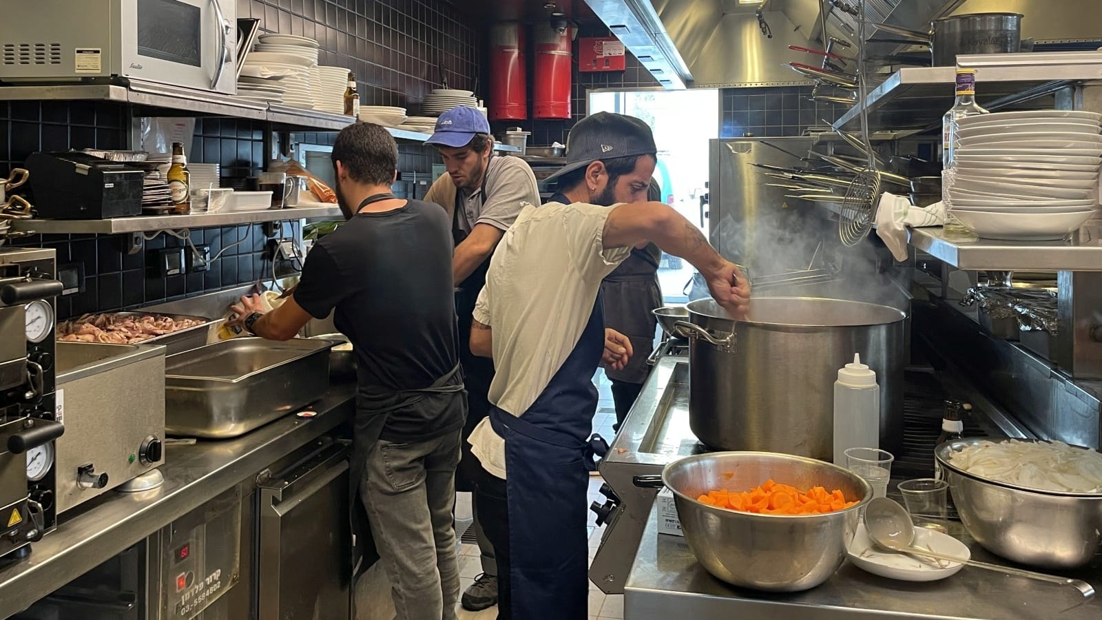 Chefs cooking up meals for soldiers and wounded or displaced civilians, at Asif Culinary Institute. Photo by Natalie Selvin