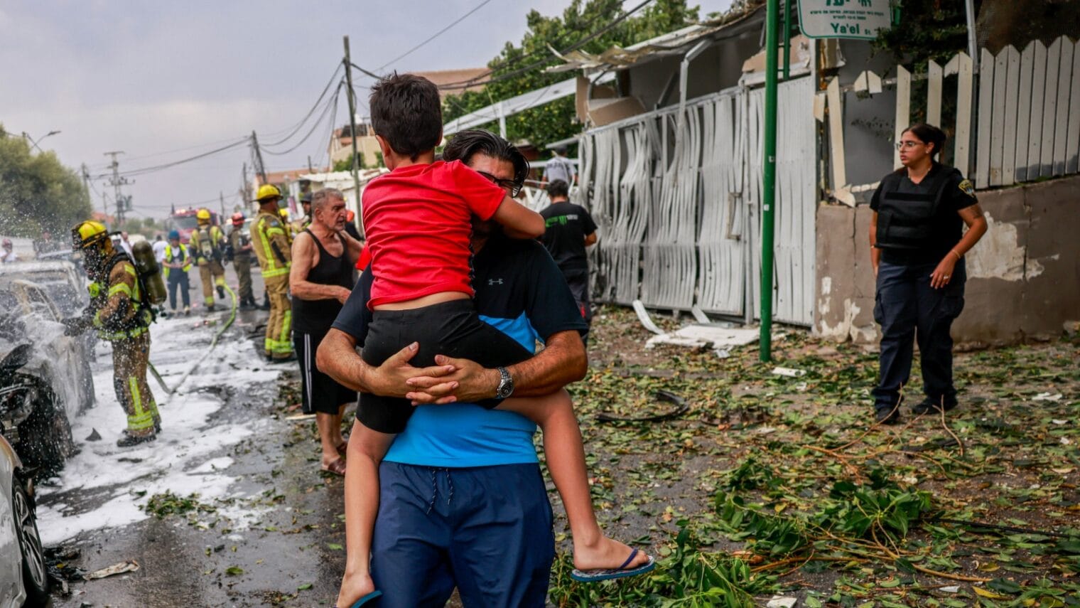 The scene where a rocket fired from the Gaza Strip hit a building and cars in the southern Israeli city of Ashkelon, October 9, 2023. Photo by Chaim Goldberg/Flash90