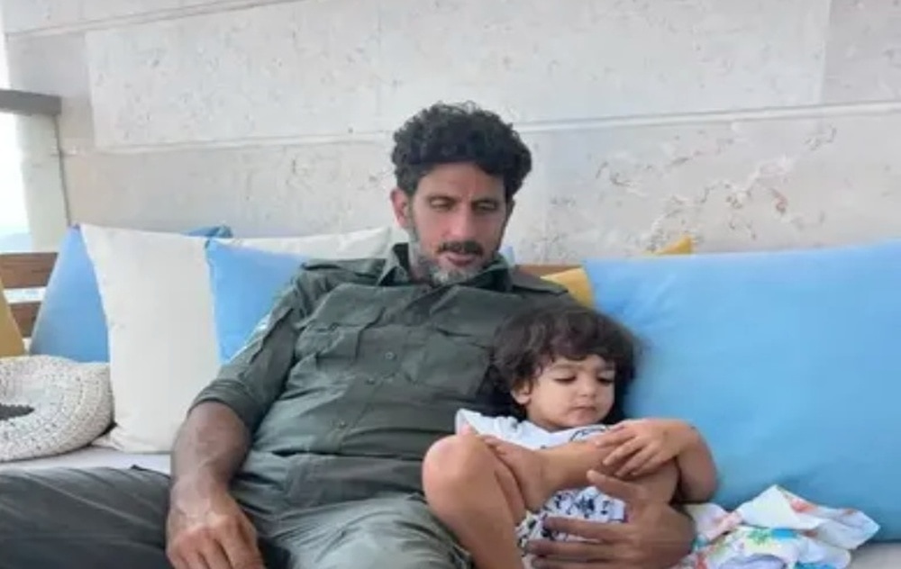 Fauda star Tsahi Halevi with his son wearing an Israeli army uniform. Photo courtesy of Lucy Aharish via Instagram
