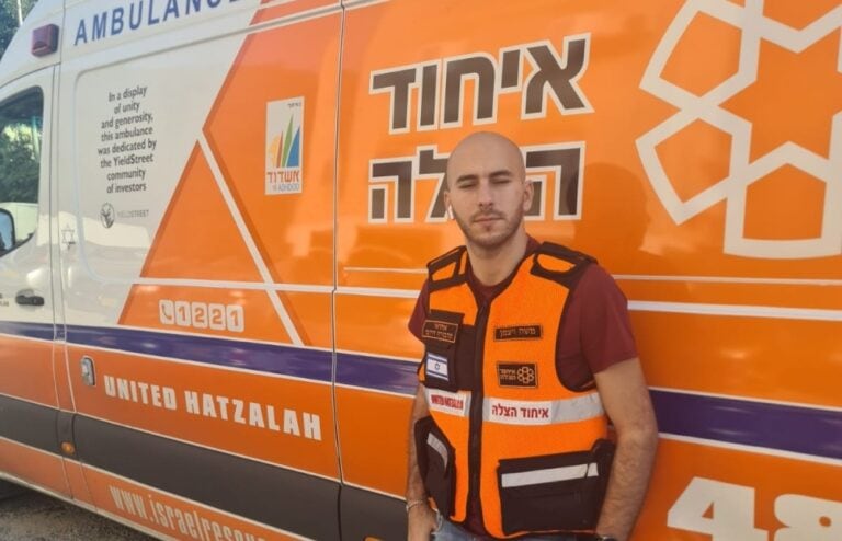 Two United Hatzalah staffers visiting EMT Moshe Weitzman in the hospital. Photo courtesy of United Hatzalah