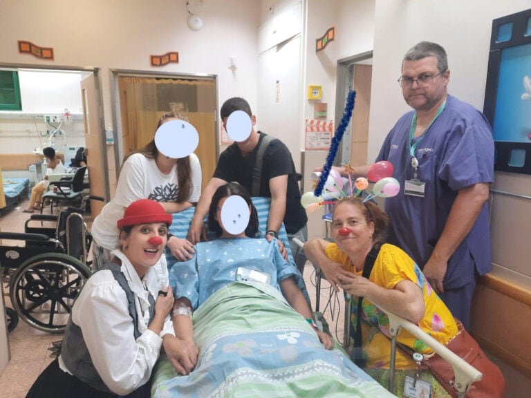 Dream Doctors accompanying an injured young woman from Kibbutz Be'eri, where her mother and brother were killed. Photo courtesy of Dream Doctors