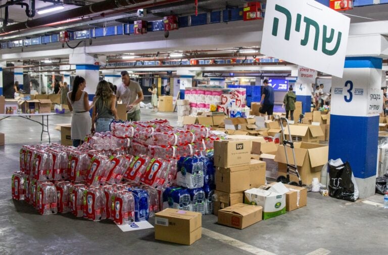 Eran’s Angels staging area for water and other drinks to pack and distribute. Photo by John Jeffay