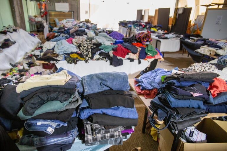 Donated clothes for evacuees at Isrotel Yam Suf hotel, Eilat. Photo by John Jeffay