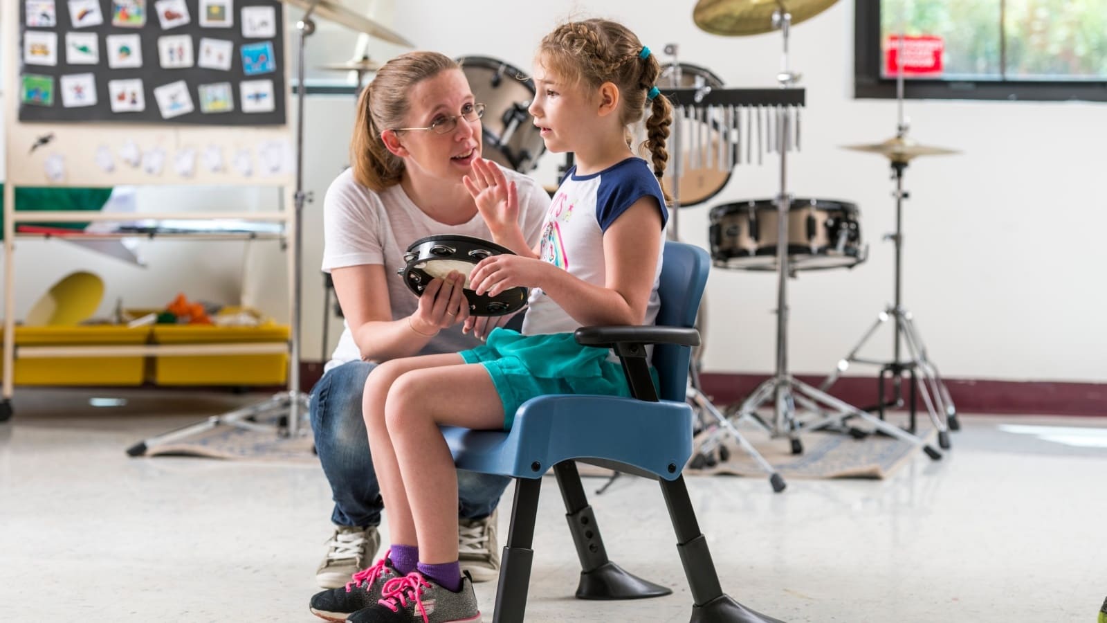 A therapist working with a mobility-challenged child. Photo courtesy of Rifton via the Malki Foundation