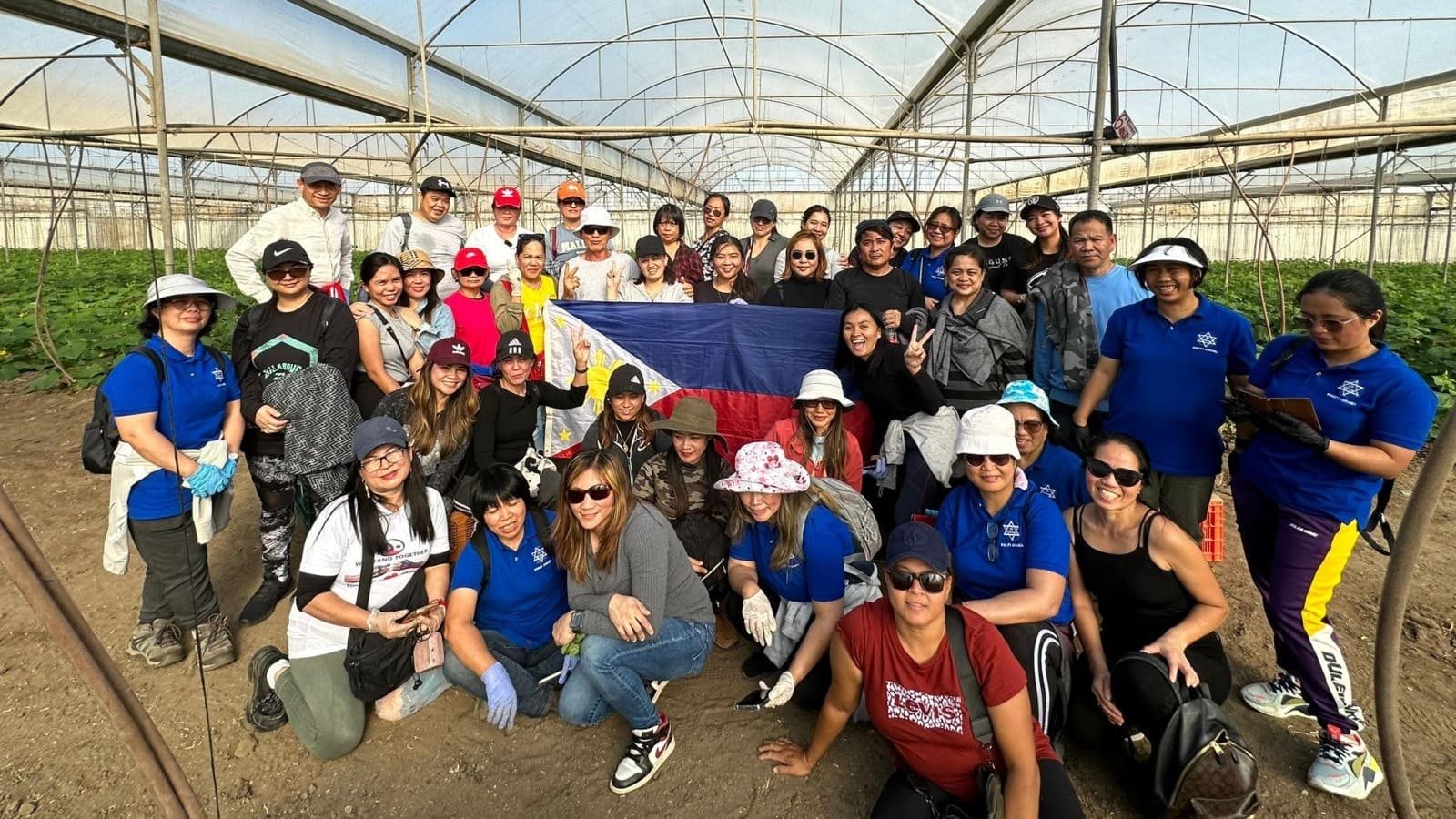 Filipino volunteers on an Israeli farm. Photo by Brian Noel