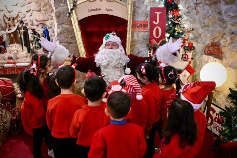 Issa Kassissieh, the Jerusalem Santa, welcoming children to the Santa House in Jerusalem’s Old City. Photo courtesy of Issa Kassissieh