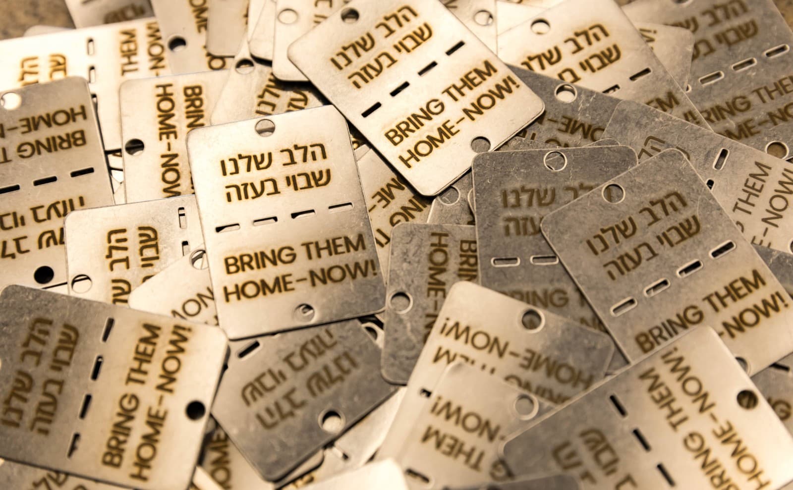 Dog tags raise awareness to the issue of hostages still held in Gaza. Photo by Barak Ziv