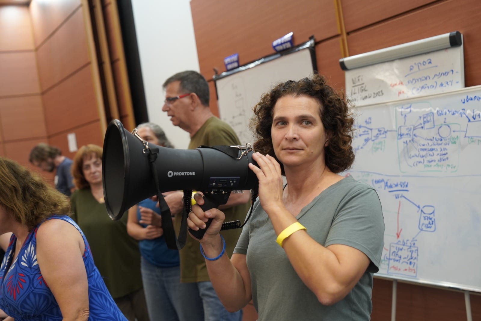 Prof. Karine Nahon giving direction to volunteers in the war room set up after October 7 at Expo Tel Aviv. Photo by Nati Marcus