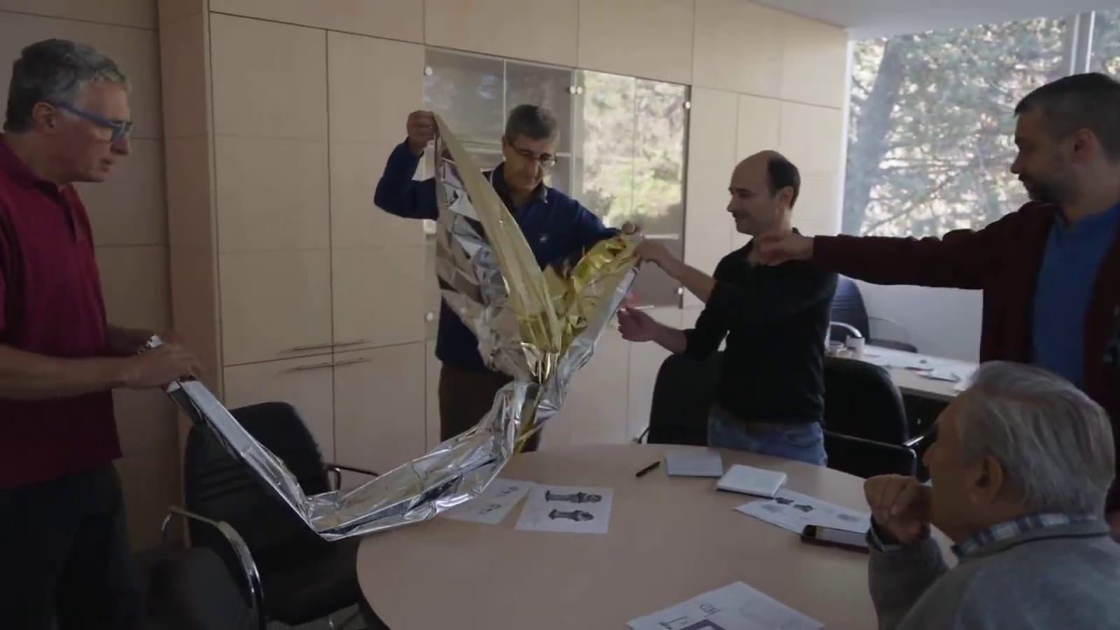 Scientists at Asher Space Research Institute checking out sunshade materials. Photo: screenshot