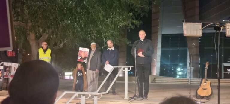 Father Roman Kaminski leading a prayer, with Rabbi Michael Ibn-David and Sheikh Ali Ziyadne in the background. Photo by Yulia Karra