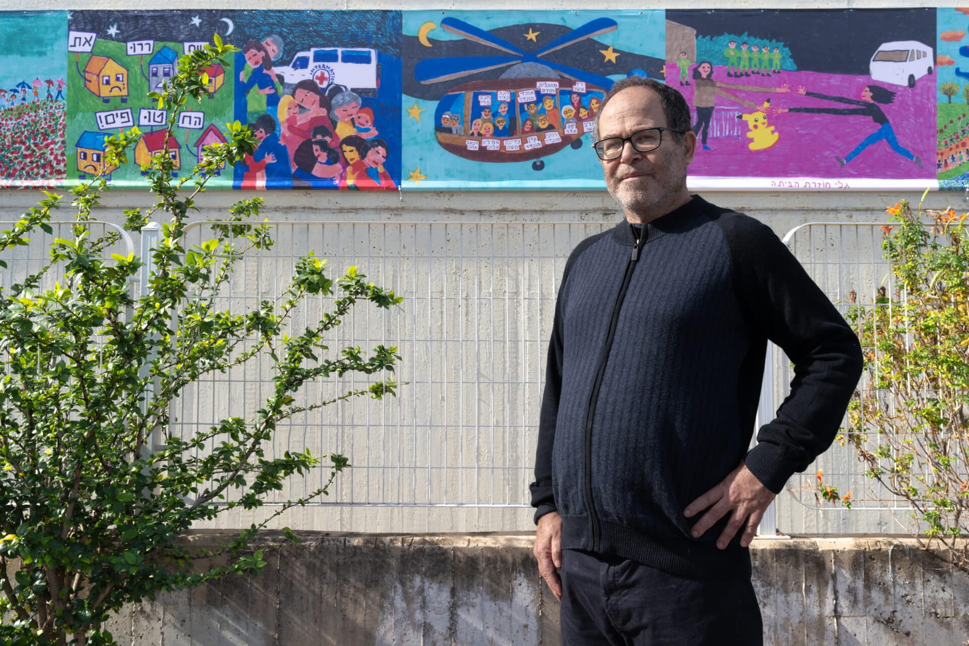Zeev Engelmayer with some of works displayed at the Herzliya Museum of Art. Photo by Daniel Chanoch
