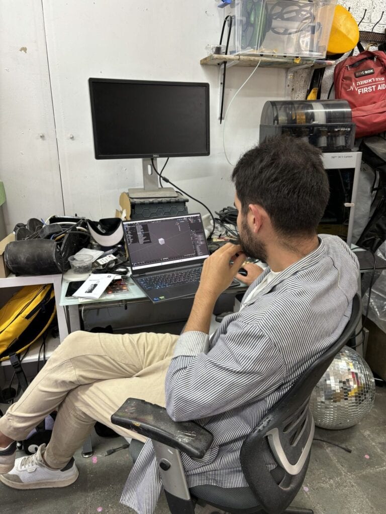 Orgad Edery creating a costume design on a computer. Photo by Natalie Selvin