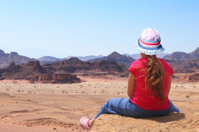 Marveling at the ancient landscape at Timna Park. Photo by Protasov AN via Shutterstock.com