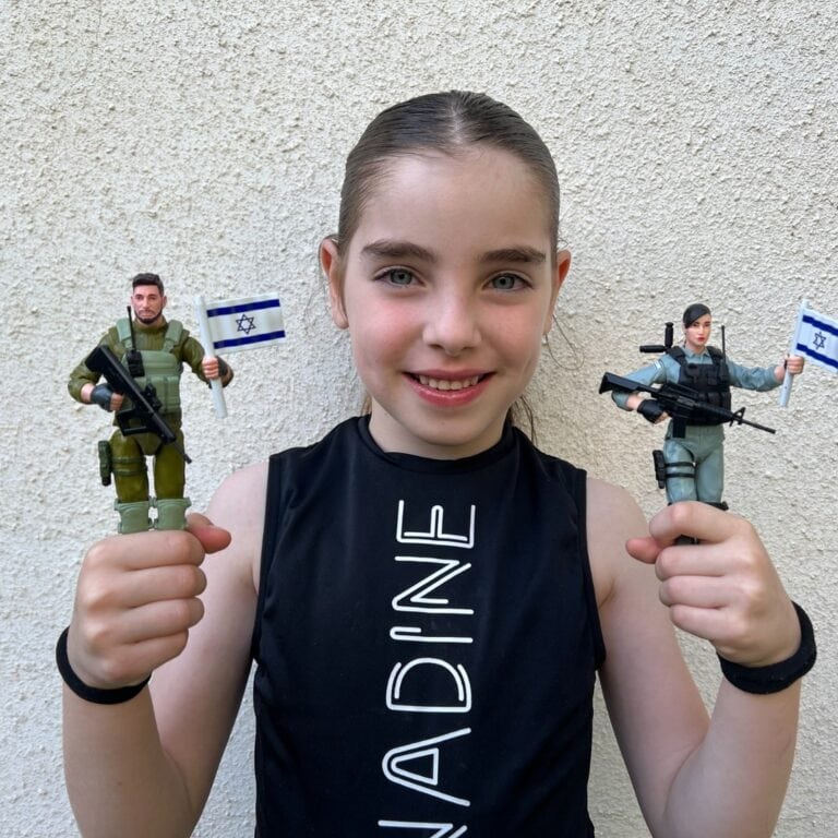 An Israeli child holding the Giborei Israel toy soldiers. Photo courtesy of Giborei Israel