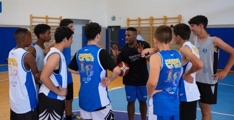 Jared Armstrong talking to a group of children at a basketball tournament in Ashkelon. Photo by Yakir Sayada