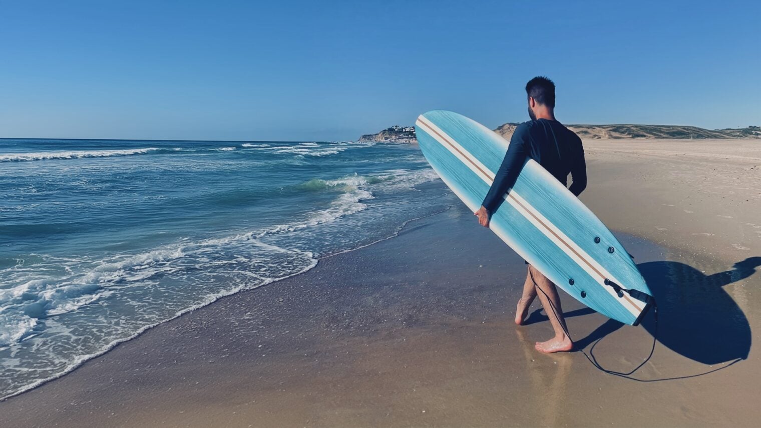 Eyal Gamba at a beach on the Mediterranean, finding strength through surfing.  Photo courtesy Eyal Gamba