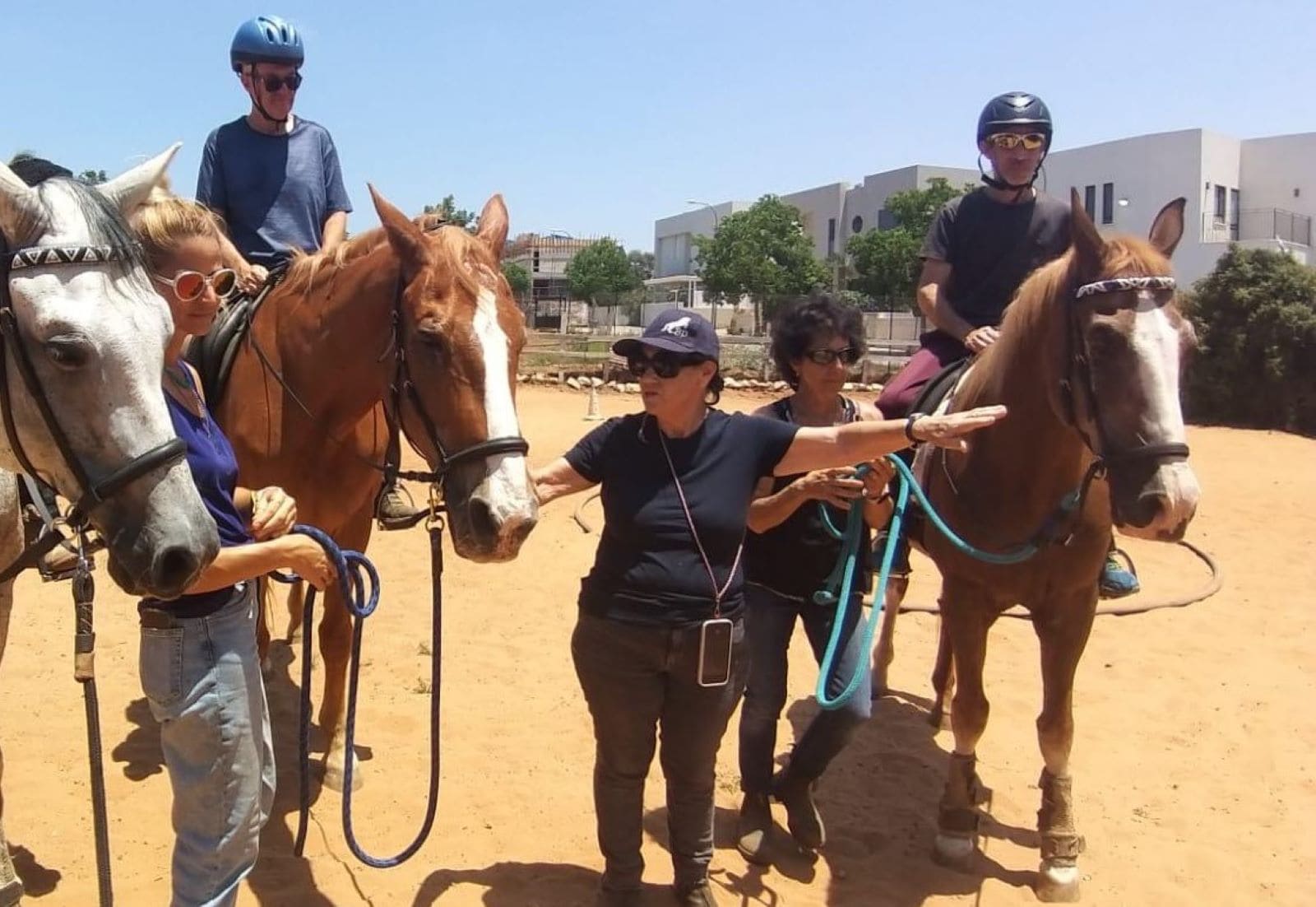 Anita Shkedi, center, directing equine therapy at Transcending Trauma. Photo courtesy of Anita Shkedi