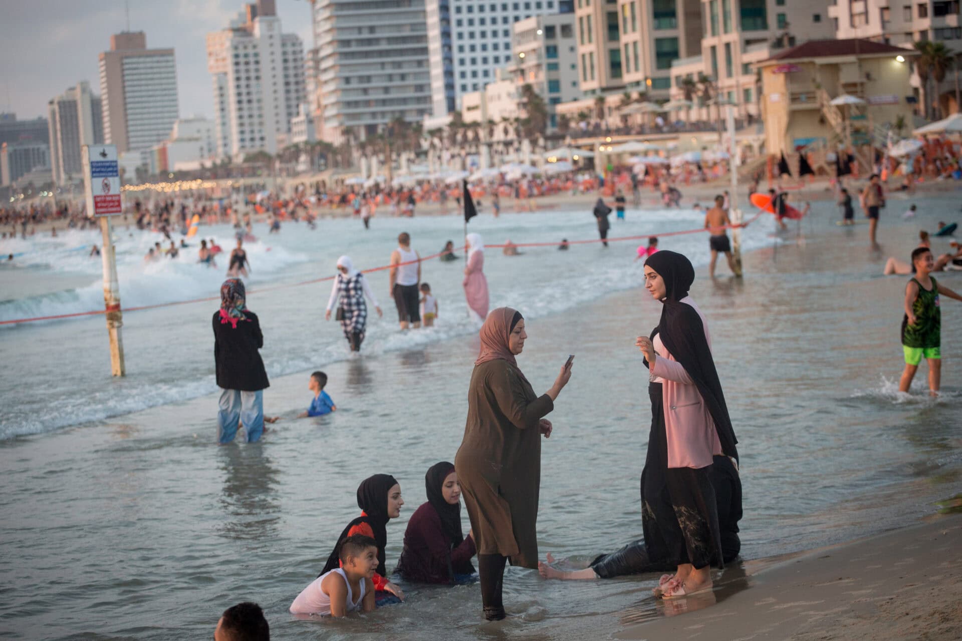 Arab women enjoy a day out on the beach in Tel Aviv. Photo by Miriam Alster/Flash90