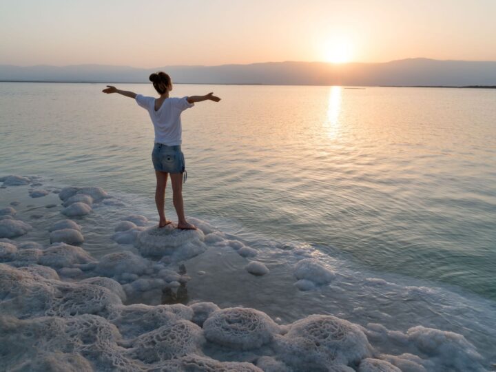 Meeting the sunrise on the shore the Dead Sea in Israel. Photo by fokusgood via Shutterstock.com