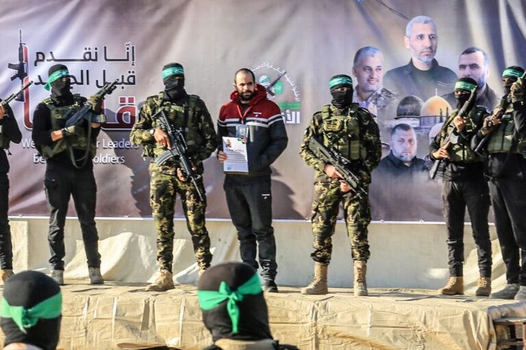 Hamas terrorists hand over hostage Yarden Bibas to the Red Cross in Khan Yunis. Photo by Abed Rahim/Flash 90
