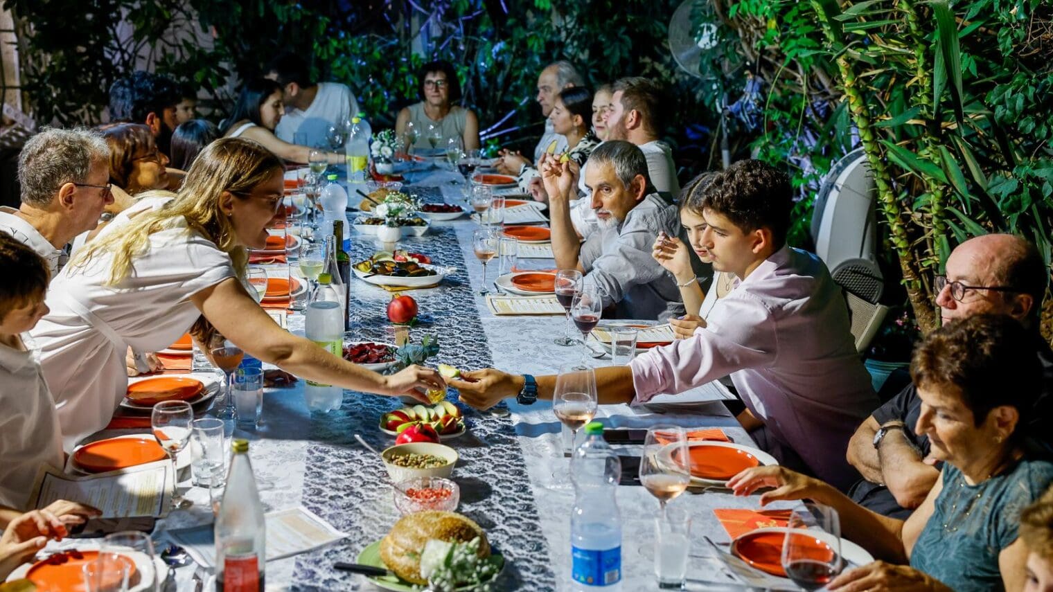 Strong relationships with family and friends are at the heart of what makes Israelis happy. An Israeli family celebrates Rosh Hashana in Ra’anana. Photo by Nati Shohat/Flash90