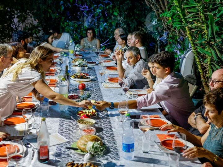 Strong relationships with family and friends are at the heart of what makes Israelis happy. An Israeli family celebrates Rosh Hashana in Ra’anana. Photo by Nati Shohat/Flash90